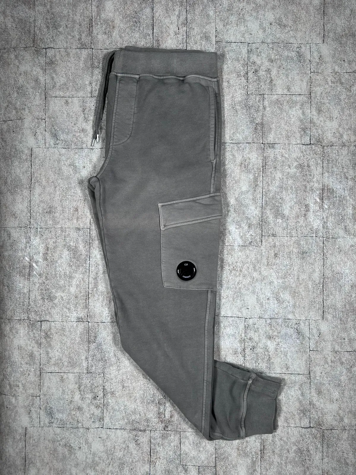 C.P. COMPANY RESIST DYED LENS SWEATPANTS