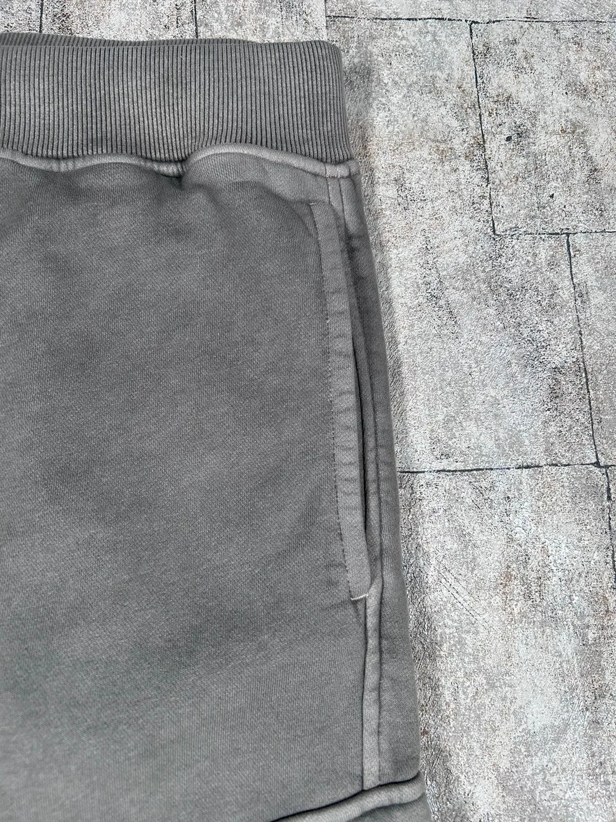 C.P. COMPANY RESIST DYED LENS SWEATPANTS