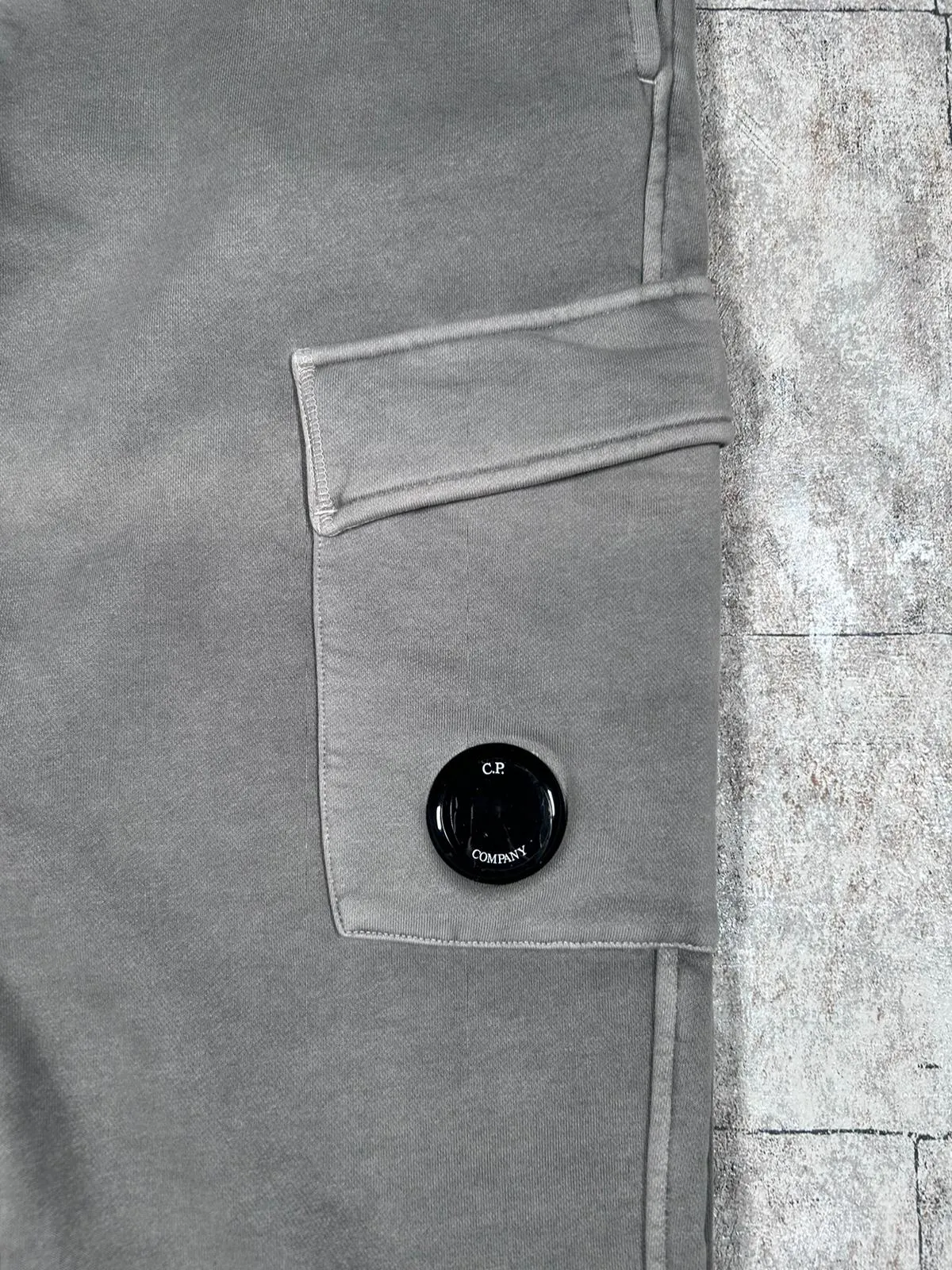 C.P. COMPANY RESIST DYED LENS SWEATPANTS